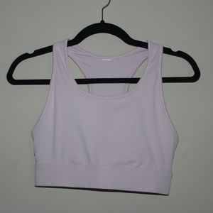 Fabletics On-The-Go Midi Medium Impact Sports Bra in Pearl Pink